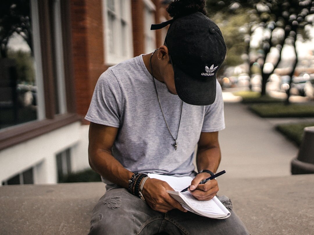 person writing in journal