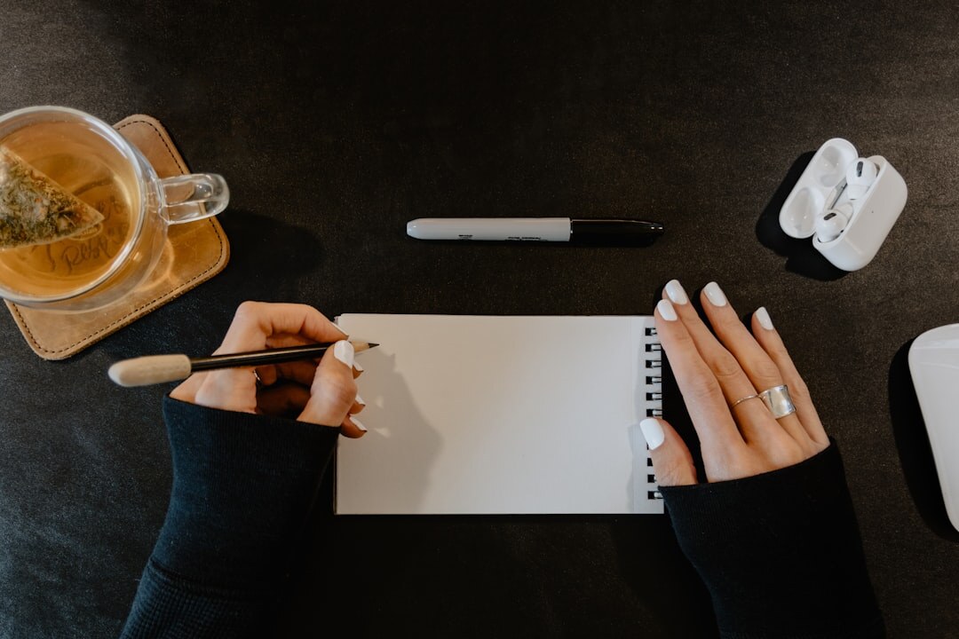 person journaling at desk