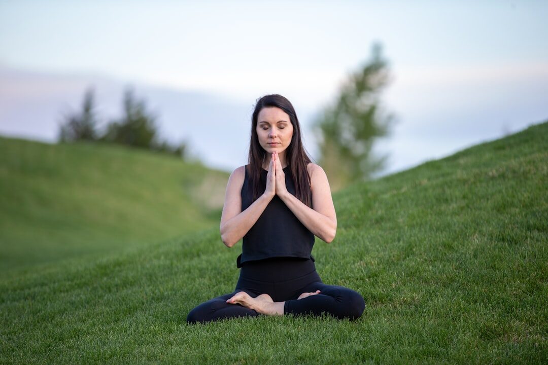 person meditating outdoors